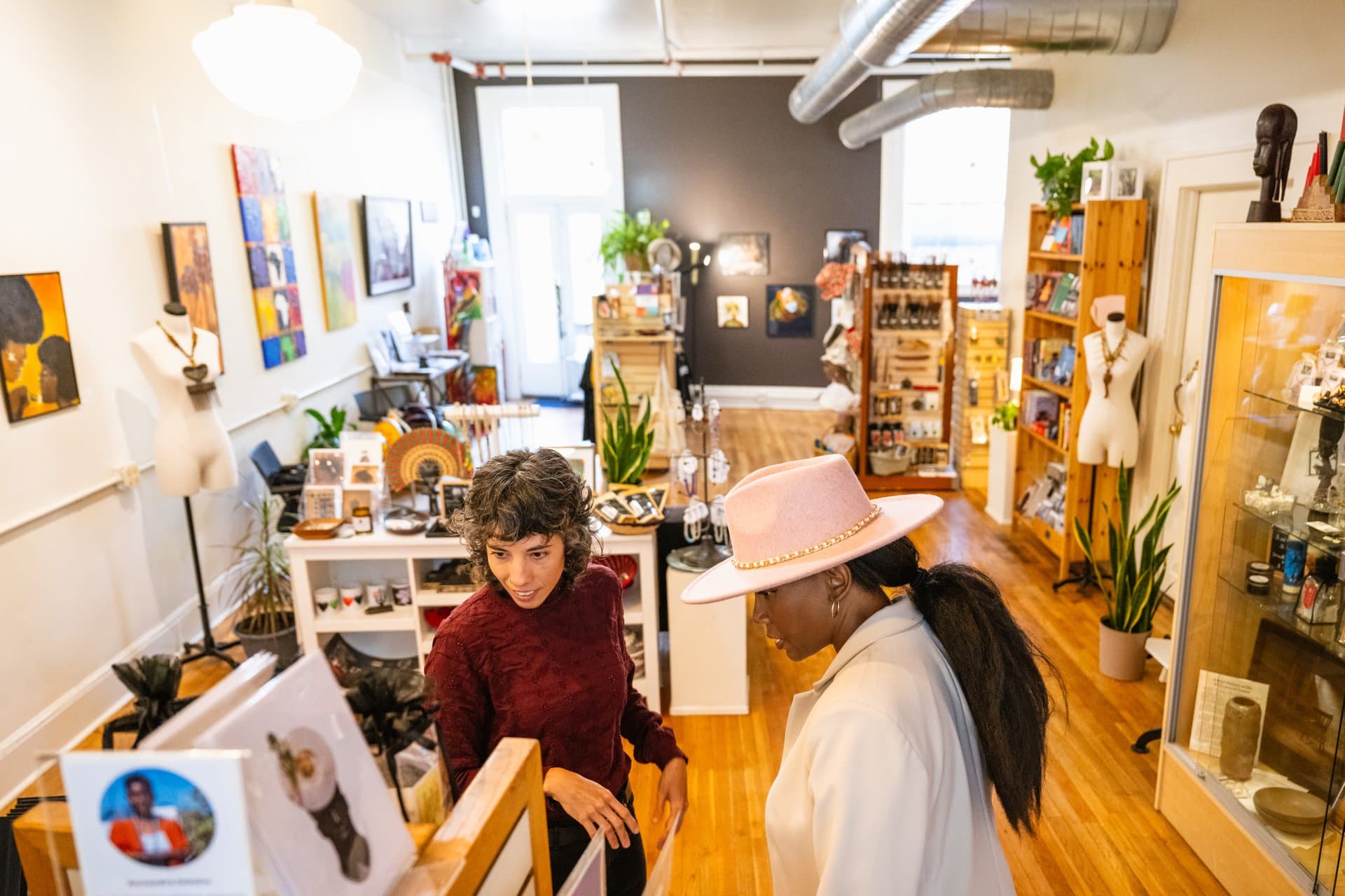 Women shopping Downtown looking at pottery