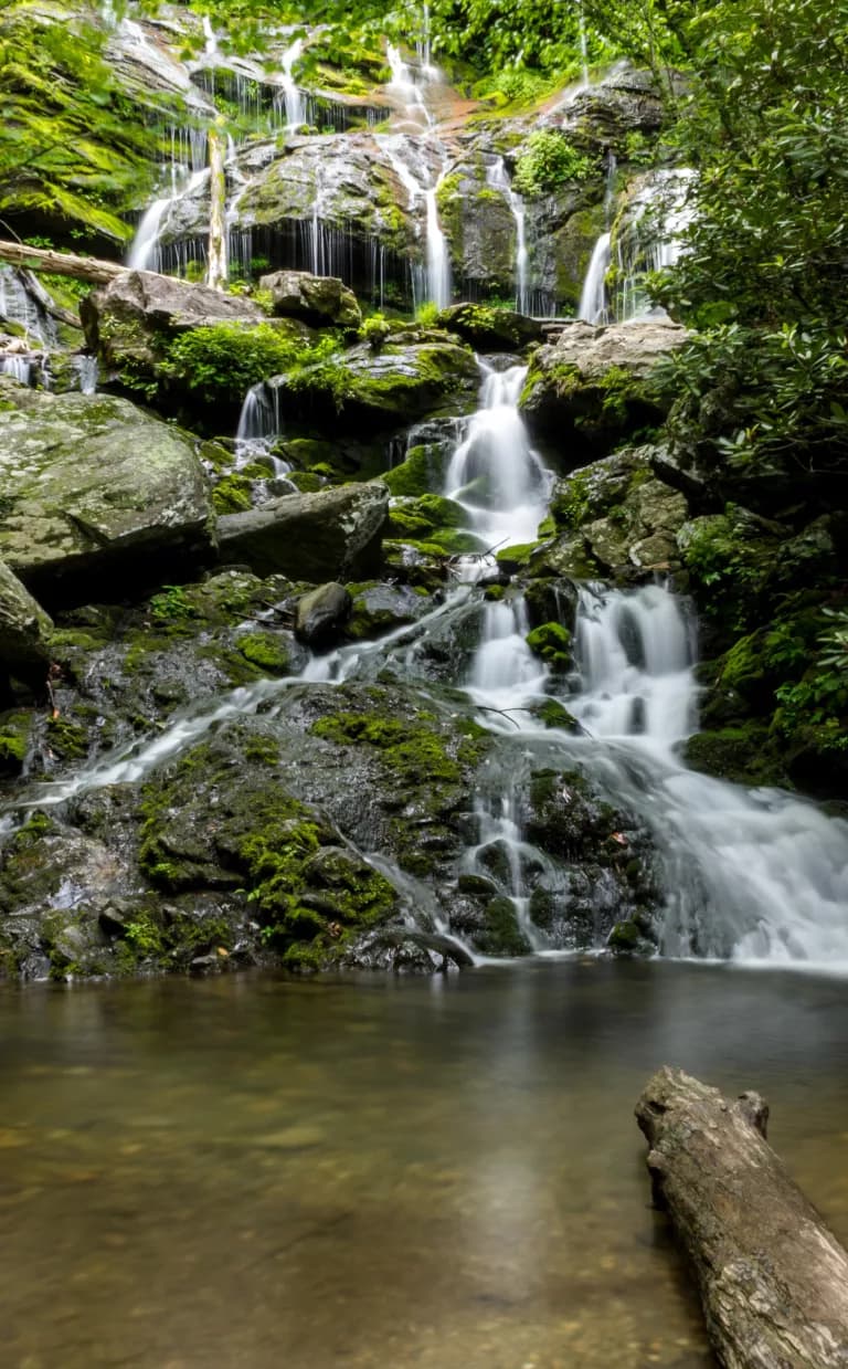 The cascade of Catawba Falls flows into a pond in Asheville