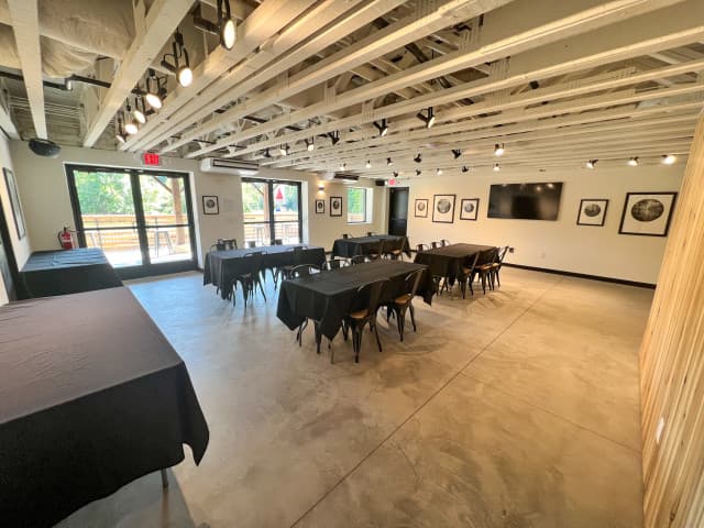 Interior of the Eddy event space, showing tables and chairs. Interior of the Eddy event space, showing tables and chairs.