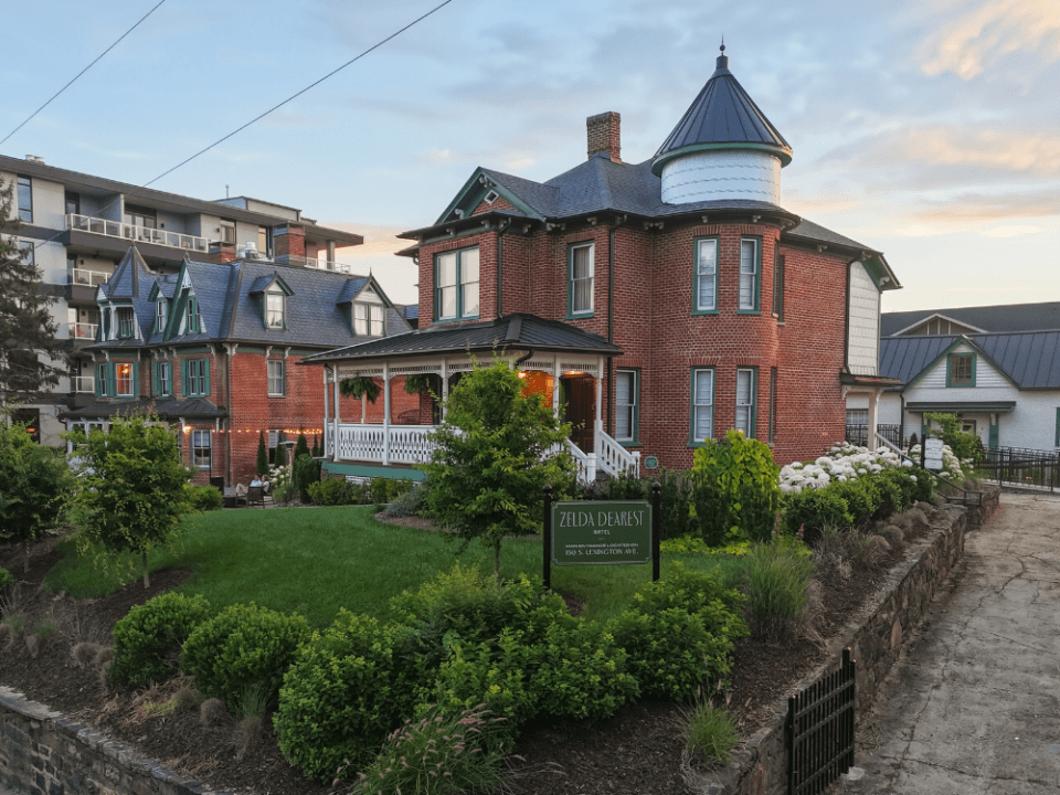two old Victorian brick houses with green lawn two old Victorian brick houses with green lawn