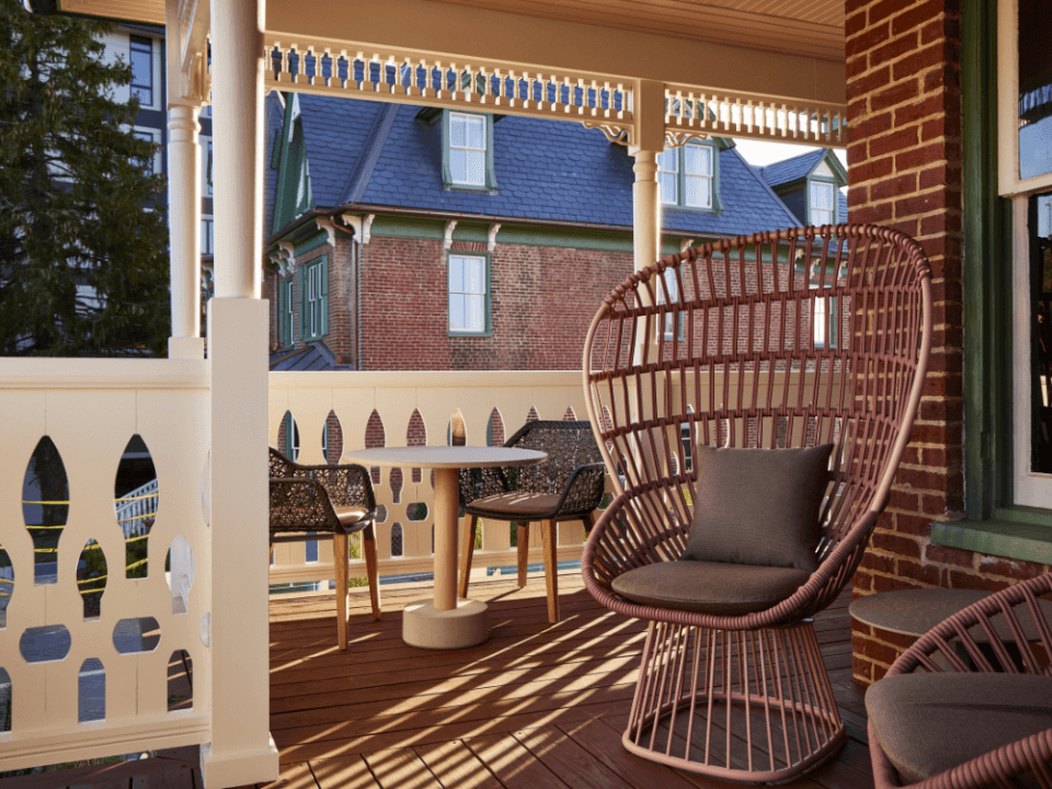 wicker egg chair on a white wrap around porch wicker egg chair on a white wrap around porch