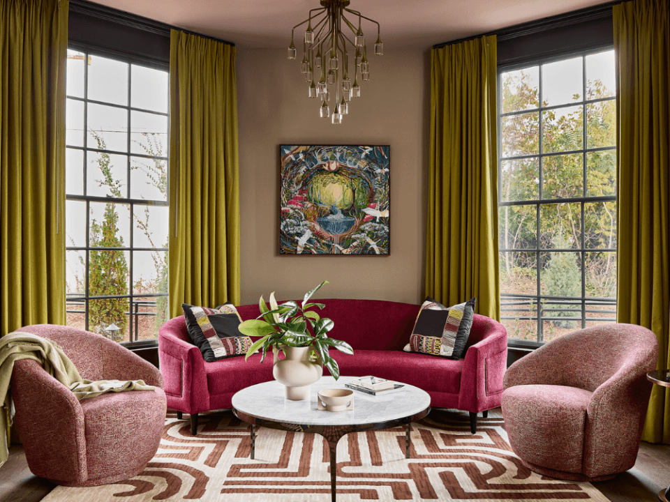 pink couches with green curtains in a living room with painting in the middle pink couches with green curtains in a living room with painting in the middle
